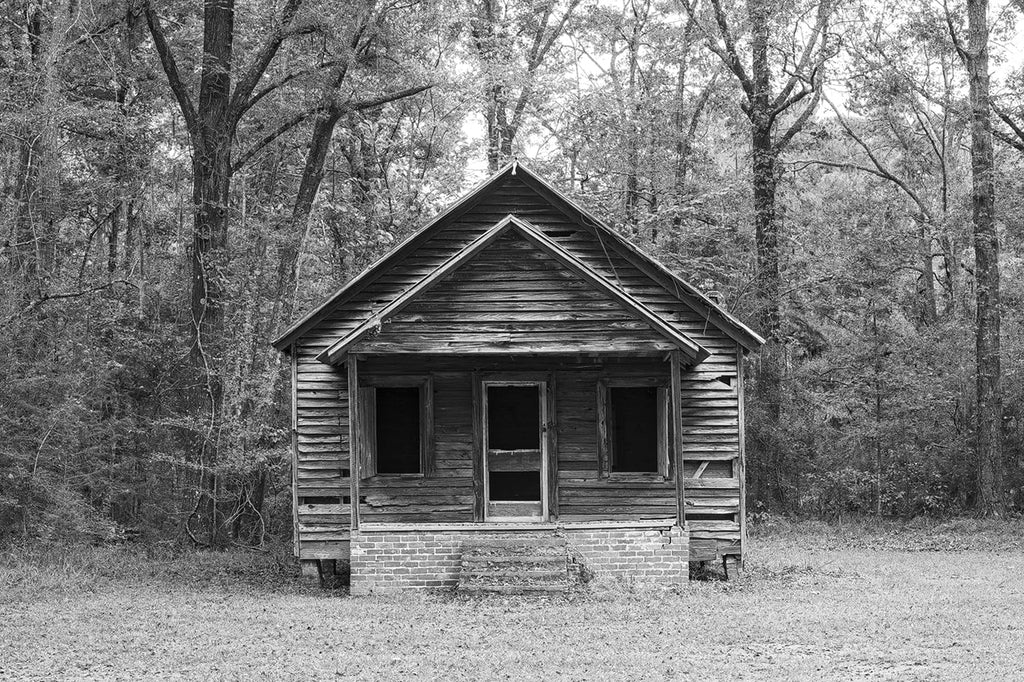 Black and white photographs of an abandoned wooden one-room schoolhouse in the forest [with behind-the-scenes video]