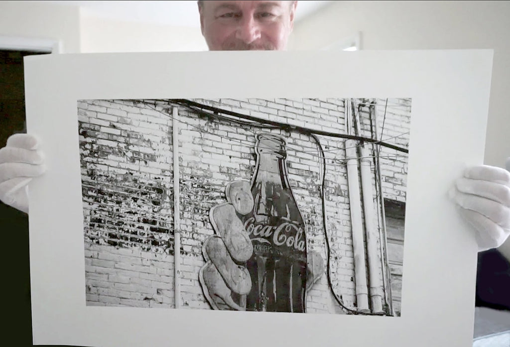 Black and white photographs of a vintage Coca Cola sign found in a Nashville alley