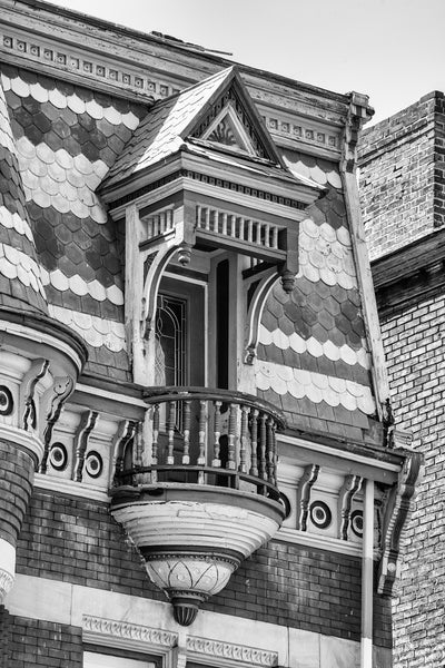 Black and white detail photograph of the beautiful and historic house built in 1889 for German immigrant Dr. Gregor Ackermann. Ackermann practiced medicine in his native Germany and then worked as a doctor for a German steamship company. In 1880 he came to Wheeling. He got married and had this home built at 2319 Chapline Street in 1889, which also served as his office as a physician and surgeon.
