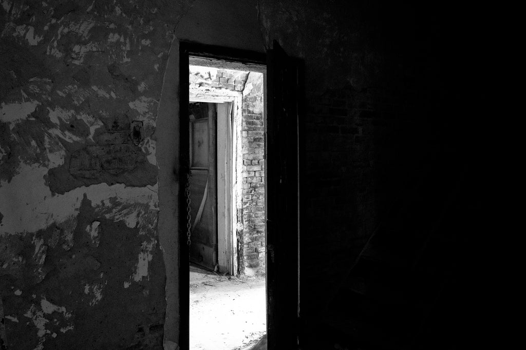 Black and white photograph of the ruined interior of an abandoned jail in Tunica, Mississippi, built 1894.