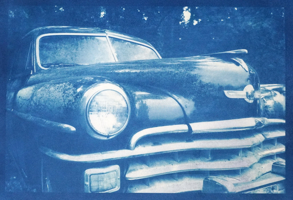 Unique, one-of-a-kind, handmade cyanotype print showing a rusty antique Chrysler automobile. The paper was hand-coated and sun-printed on high-quality Arches cold-press watercolor paper. The result is a striking blue print. Signed and dated in pencil on the back. Image area: 9-inches wide x 6-inches tall. Print only - not matted, mounted, or framed.