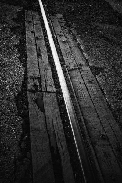 Black and white photograph of a shining railroad track in Birmingham, Alabama.