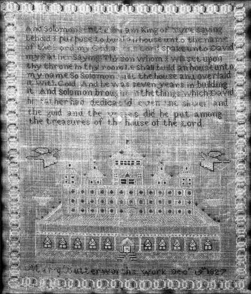 Black and white photograph of a hand-stitched sampler completed in 1827 by Mary Butterworth, seen in Birmingham's historic Arlington House. The sampler features a Bible verse at top, and the bottom reads, "Mary Butterworth's work Dec. 19th, 1827."
