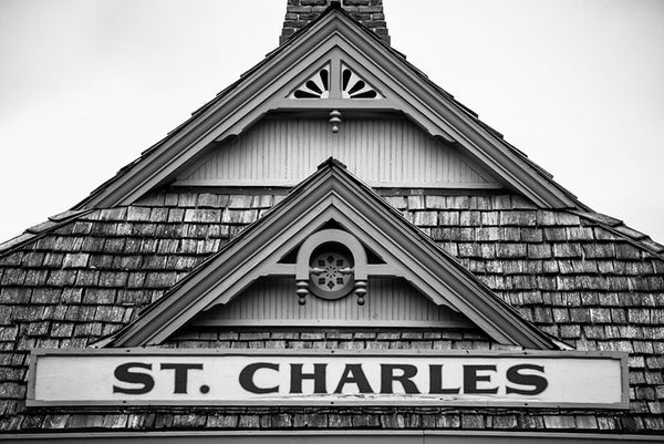 Black and white photograph of the St. Charles sign on the old train depot in the historic town of St. Charles, Missouri.