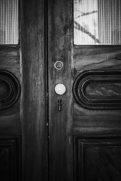 Black and white photograph of the wooden front doors of the beautiful and historic Chantillon-DeMenil Mansion in St. Louis, Missouri.