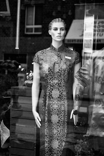 Black and white photograph of a store window display mannequin in Philadelphia's Chinatown.
