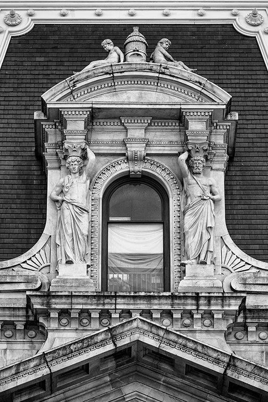 Black and white detail photograph of a window on the Old Philadelphia City Hall in downtown Philadelphia.
