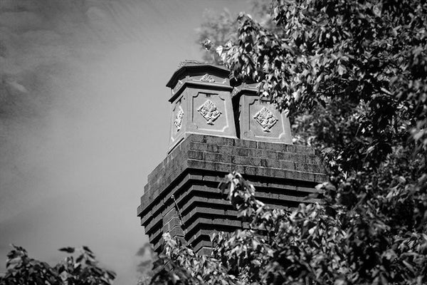 Black and white photograph of decorative chimneys on a historic home in Atlanta's leafy and eclectic Little Five Points neighborhood.