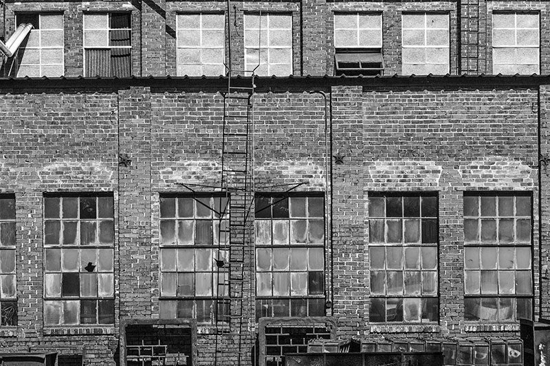 Black and white photograph of a beautifully grungy old foundry in Chattanooga's run-down industrial district.