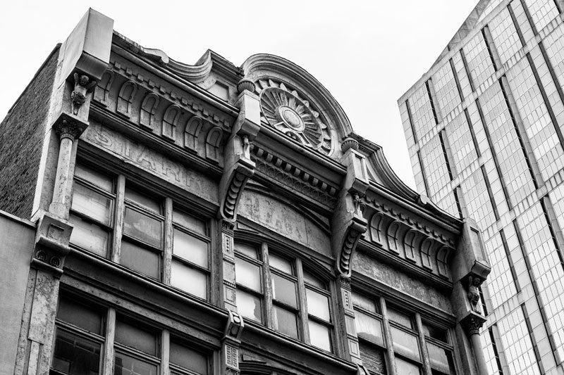 Black and white photograph of the upper level exterior of the historic French-Starr Piano Building on 5th Avenue in Nashville, Tennessee. Built in 1889, the building sold pianos and sheet music, making it an early contributor to the establishment of Nashville as Music City.