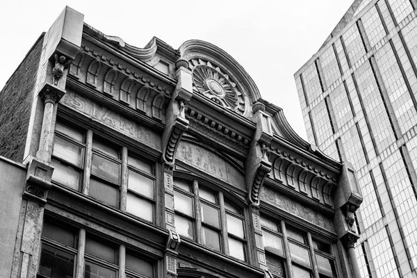 Black and white photograph of the upper level exterior of the historic French-Starr Piano Building on 5th Avenue in Nashville, Tennessee. Built in 1889, the building sold pianos and sheet music, making it an early contributor to the establishment of Nashville as Music City.