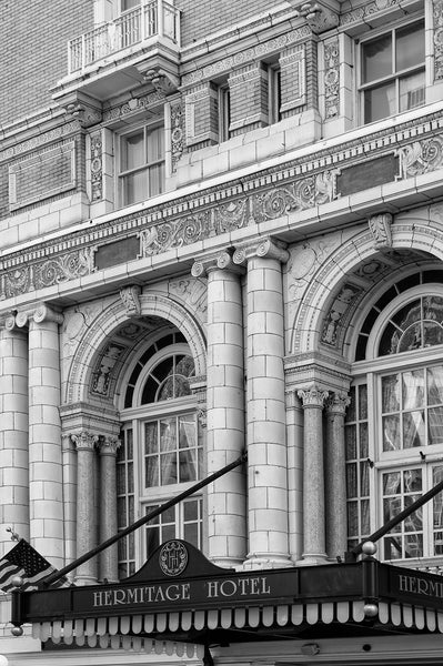 Black and white architectural photograph of the Beaux-arts exterior of Nashville's luxurious Hermitage Hotel, built in 1910. The hotel was host to elite clientele from presidents to entertainers, until it closed in 1977. It reopened in 1981, and has since been renovated to achieve its current high level of quality and service, making it the only AAA Five-Diamond hotel in Tennessee.