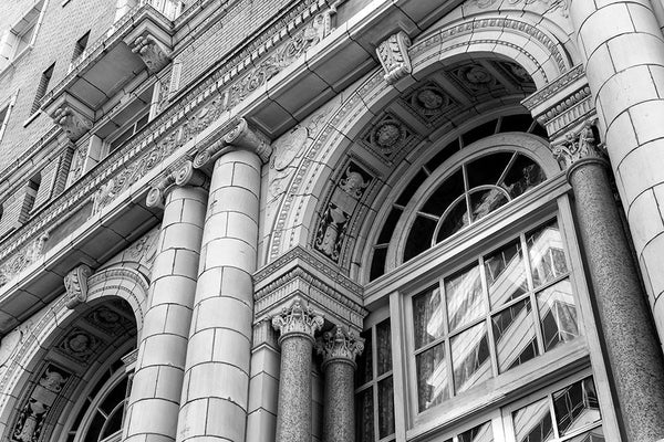 Black and white architectural photograph of the Beaux-arts exterior of Nashville's luxurious Hermitage Hotel, built in 1910. The hotel was host to elite clientele from presidents to entertainers, until it closed in 1977. It reopened in 1981, and has since been renovated to achieve its current high level of quality and service, making it the only AAA Five-Diamond hotel in Tennessee.