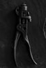Black and white detail photograph of a pair of antique Morrill Apex Saw Set Pliers, circa late 1800s. These pliers were used to straighten the teeth of says, particularly used in the logging industry.