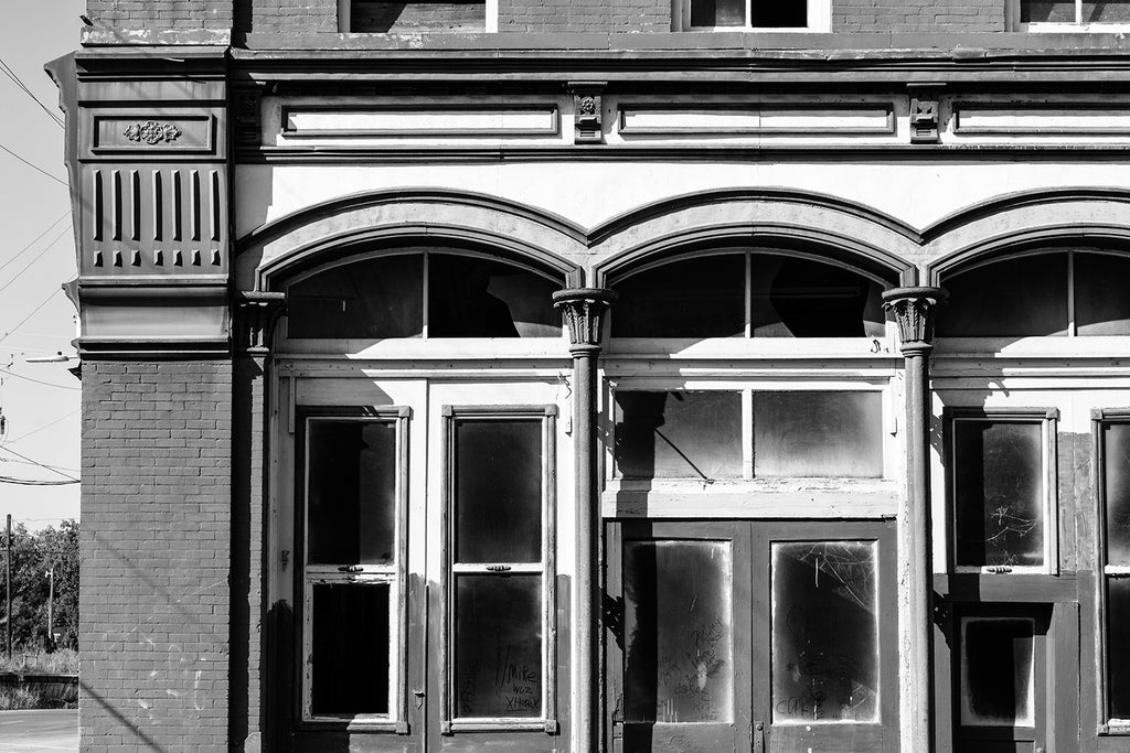 Black and white photograph of an abandoned historic industrial building in downtown Meridian, Mississippi. The building has since been destroyed by fire.