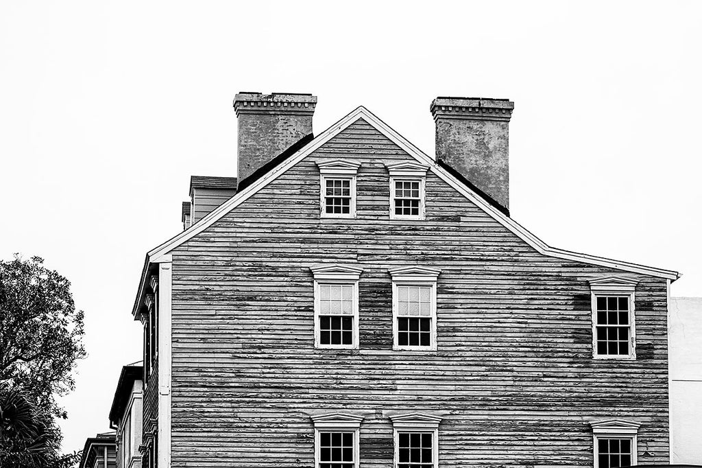 Black and white photograph of beautiful, textural historic architecture in one of Savannah's historic districts. 