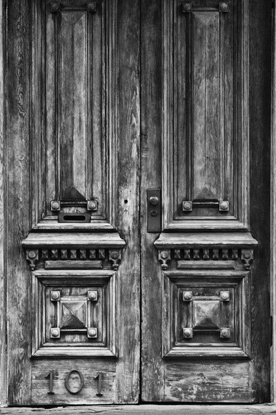 Black and white photograph of two beautifully weathered and aged wooden doors in Savannah's historic district at house no. 101.