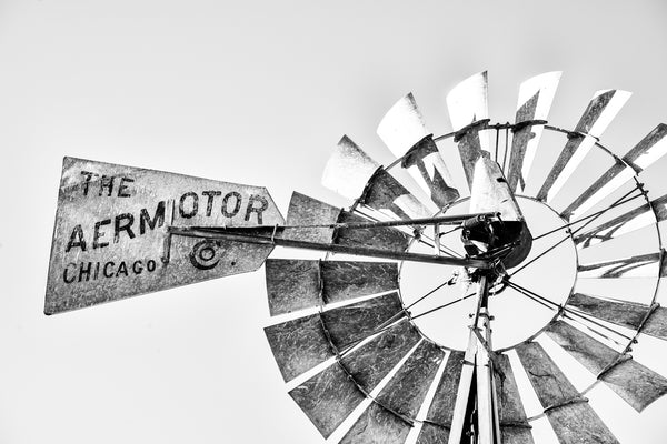 Black and white photograph of an old windmill in the American southwest that says "The Aermotor Co. Chicago".