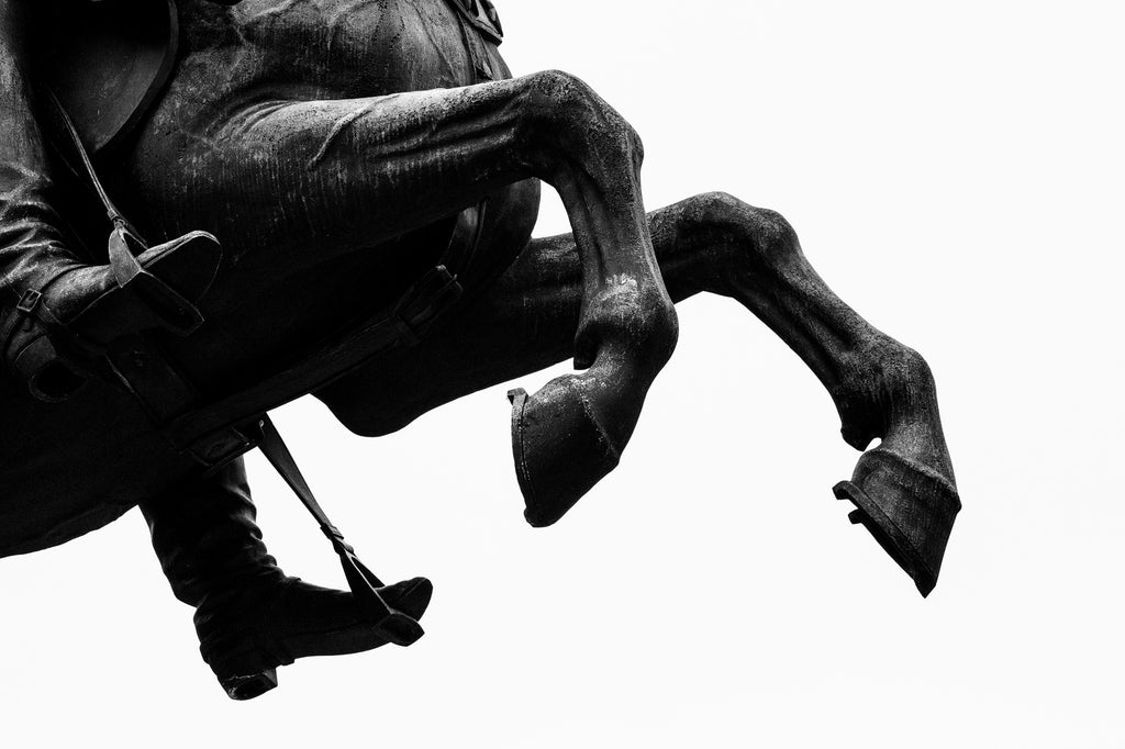 Black and white photograph of horse hooves from an equestrian statue located on the grounds of the Tennessee State Capitol in Nashville.