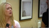 A scene from the 2010-2015 television show melissa and joey showing two photographs by keith dotson, including curly vine by a lake shore on the far right.