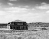 Black and white photograph of a final standing officer's quarters from 1880s-era Fort Keogh outside Miles City, Montana.
