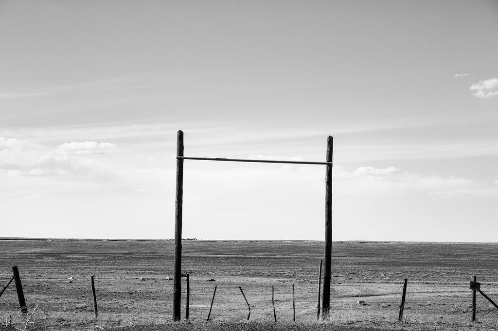 Black and white landscape photograph of the wide-open rangeland of northeastern New Mexico.