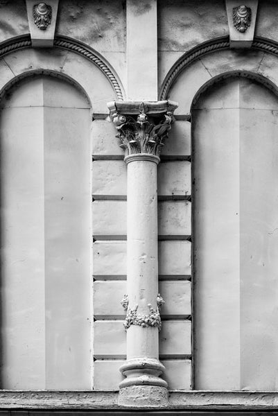 Black and white architectural detail photograph of Nashville historic Climax Saloon, on 4th Avenue. The Climax Saloon was opened in 1887 with the aim of selling the product of a local whiskey distiller. It hosted can-can dancers on the first floor. On the second floor was a bar and gambling. On the third floor was a brothel. Also on the third floor were hidden chambers where prostitutes would hide during police raids.