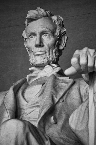 Black and white photograph of the magnificent statue of Abraham Lincoln at the Lincoln Memorial in Washington, D.C.