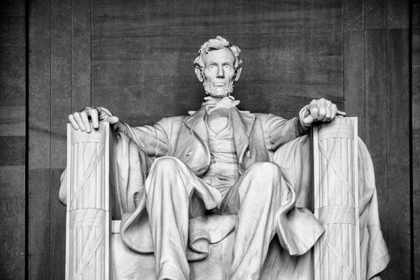 Black and white front view photograph of the magnificent, massive statue of Abraham Lincoln at the Lincoln Memorial in Washington, D.C.