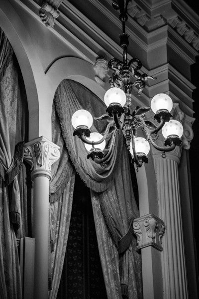 Black and white photograph of the ornate interior of historic Ford's Theater in Washington, DC. Ford's is infamous as the site where President Lincoln was shot in the head by actor John Wilkes Booth on April 14, 1865.