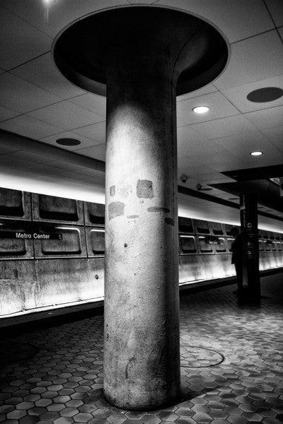 Black and white photograph of the Metro subway underground platform in Washington, DC.