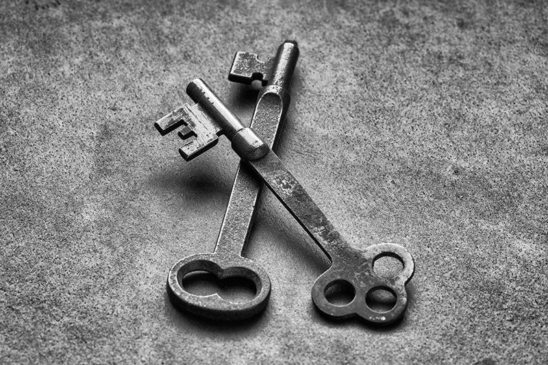 Black and white photograph of two antique door keys