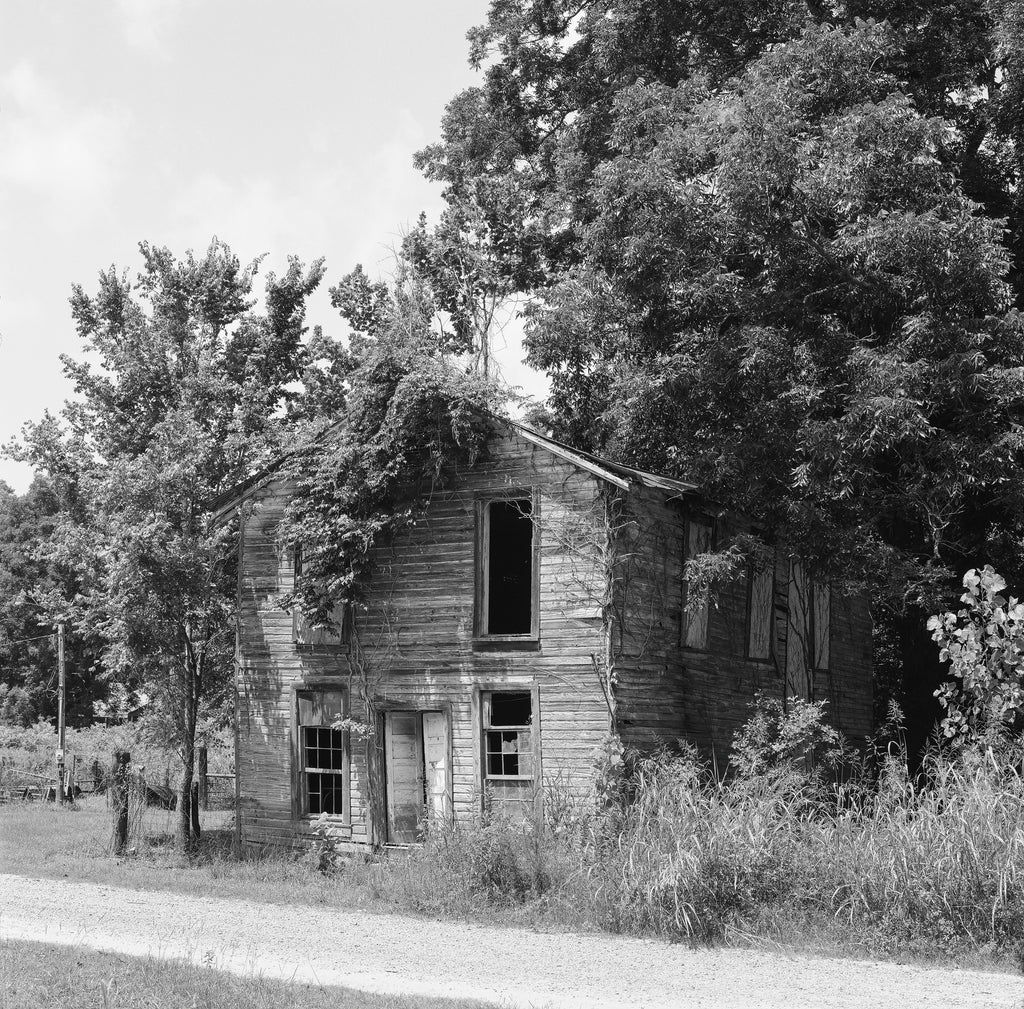 Black and white photograph of the old wooden Masonic Lodge (Mississippi Lodge #56 of the Free and Accepted Masons) located in Rodney from the 1850s until the 1920s. Now abandoned the lodge is one of the few remaining structures in Mississippi's Rodney Ghost Town.