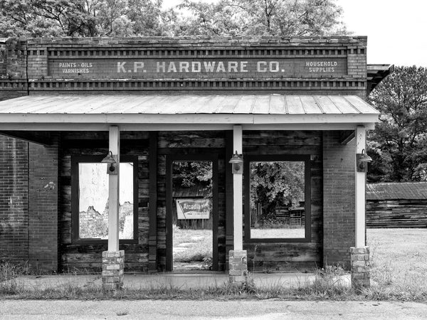 Black and white photograph of an abandoned ruin in the small town of Haralson, Georgia, known for its appearances as a location in the TV show The Walking Dead.