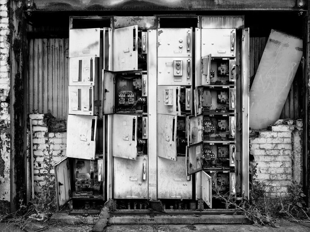 Black and white medium format photograph of the electricity panels and circuit breakers on the outside of Chattanooga's vast, abandoned Wheland Foundry, which closed in 2003.