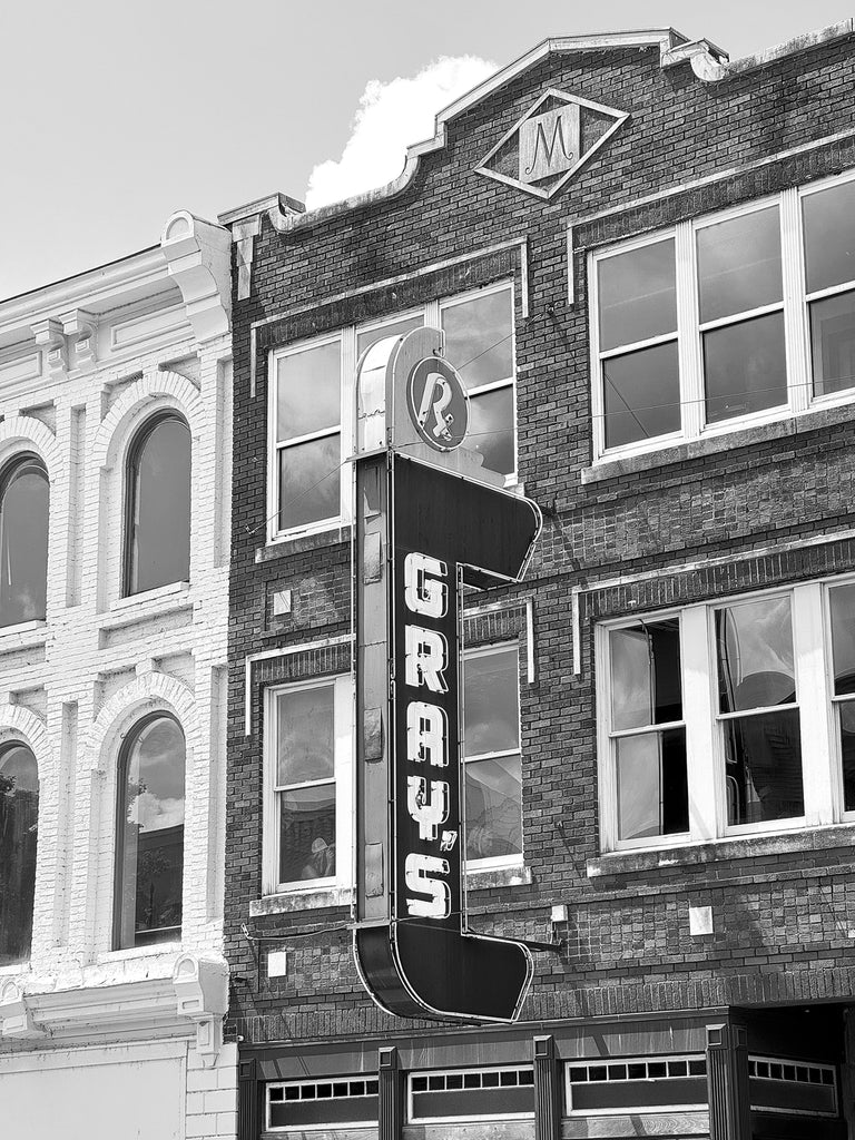 Black and white photograph of the vintage Gray's Drug Store sign on Main Street in Franklin, Tennessee.