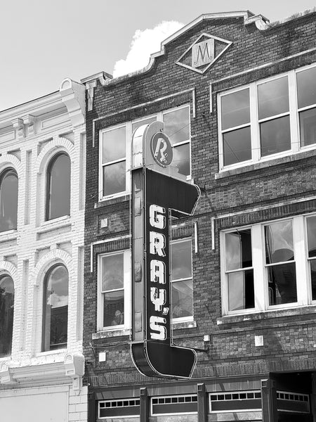 Black and white photograph of the vintage Gray's Drug Store sign on Main Street in Franklin, Tennessee.