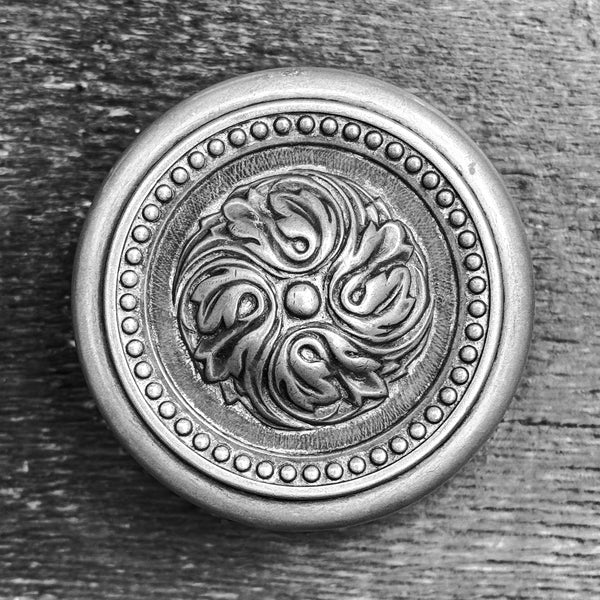 Black and white photograph of a beautifully ornate old door knob seen on a historic building in downtown Franklin, Tennessee. (Square format)
