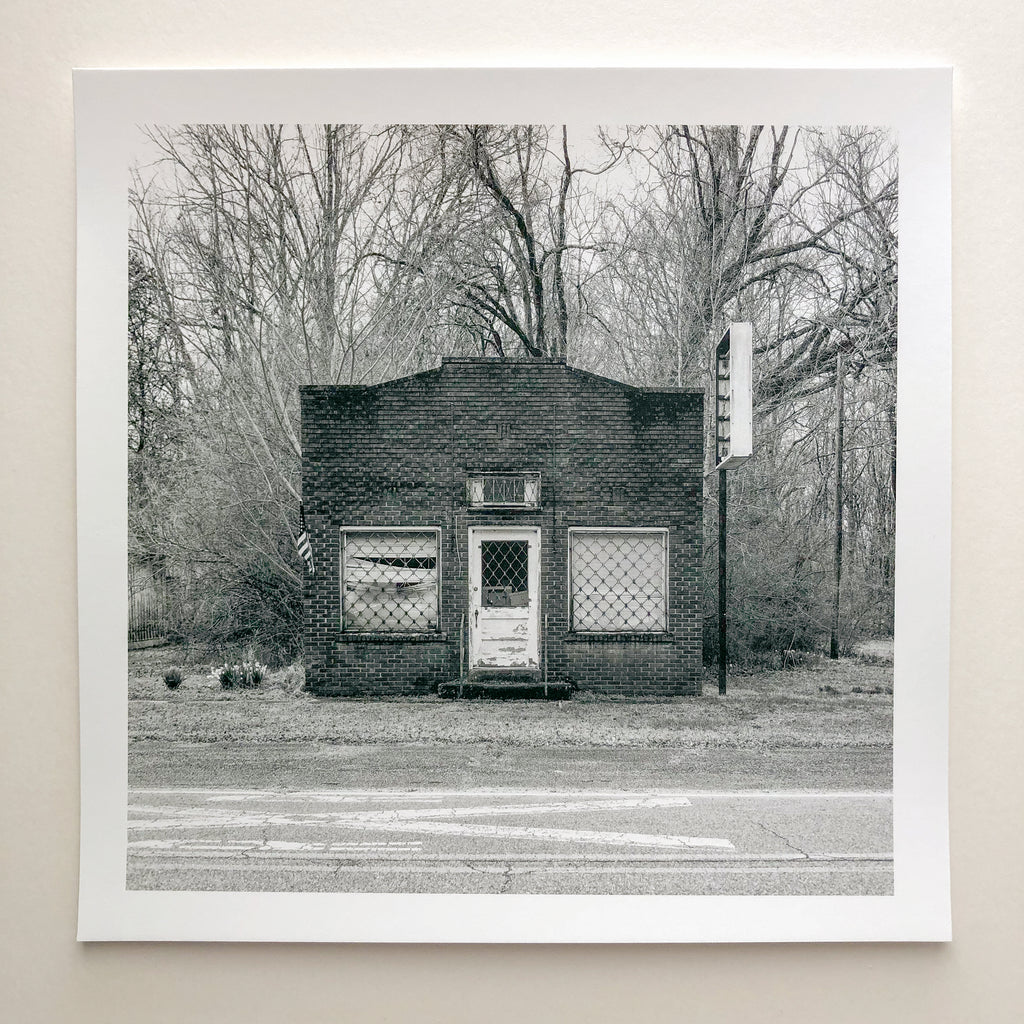 Mississippi Abandoned Storefront by Keith Dotson, black and white print on uncoated Hahnemühle Photo Rag Mat Baryta paper. This is a sample print made by Keith Dotson for a YouTube video, offered at a special price.