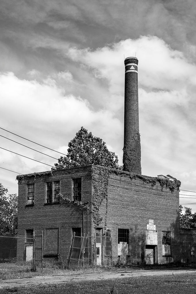 Black and white photograph of the old Maintenance Building located on the grounds of the abandoned high school in Clarksdale, Mississippi.