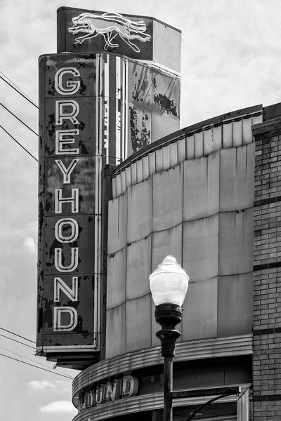 Black and white photograph of the vintage Greyhound Bus Station sign in downtown Clarksdale, in the heart of the Mississippi Delta.