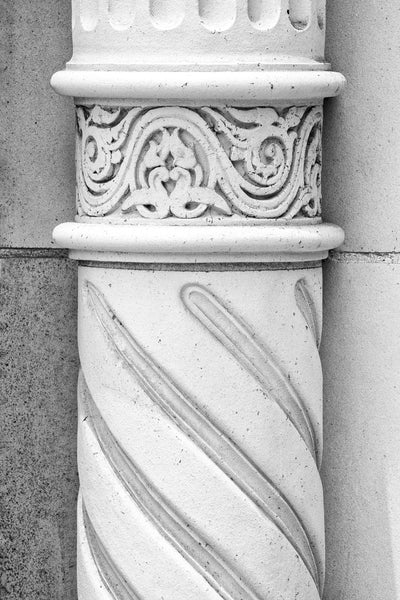 Black and white photograph of a carved stone column from a historic theatre in downtown meridian mississippi.