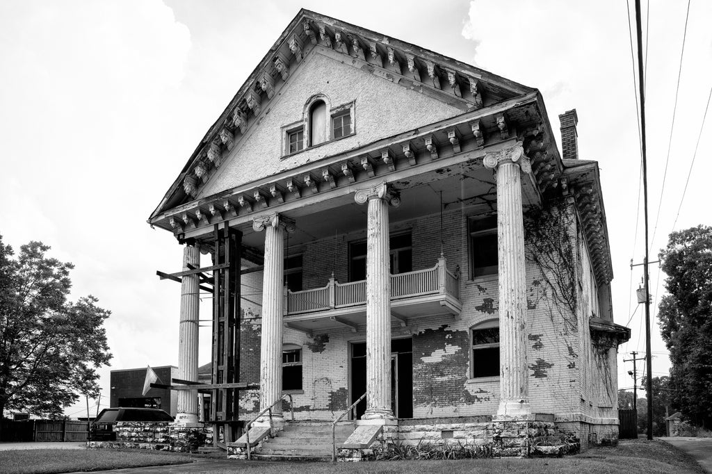 Black and white photograph of the abandoned Copeland Mansion in the historic Norwood neighborhood of Birmingham, Alabama.