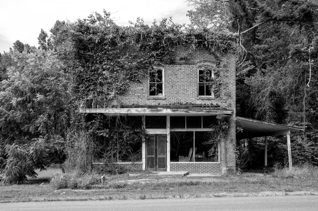 Black and white photograph of the historic abandoned C.S. Dunn Hardware Store in Baskerville, Virginia, which opened in 1910 and closed in the 1980s.