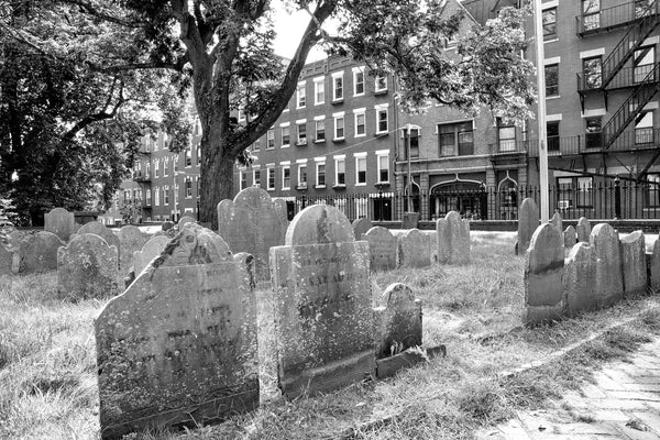 Black and white photograph of colonial era tombstones in the historic&nbsp;Copp's Hill Burying Ground, established in 1659 on a hilltop near the Old North Church in Boston.