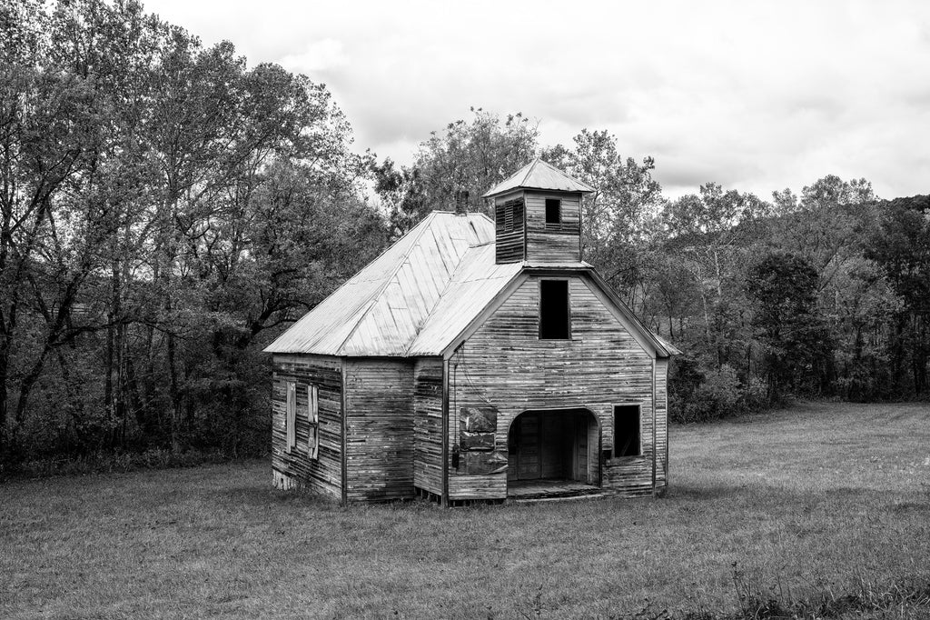 Black and white photograph of the abandoned historic Lays Gap School found along a backroad deep in the hills of East Tennessee.