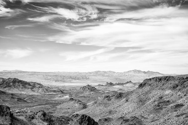 Black and white landscape photograph of the vast, rugged mountain landscape of Arizona seen from the Sitgreaves Pass in the Black Mountains near Oatman