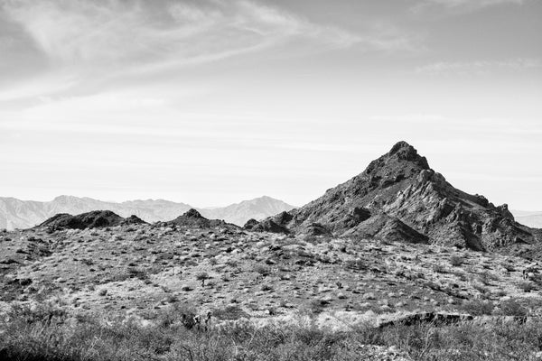 Black and white photograph of the beautifully rugged Arizona landscape featuring desert and mountains.