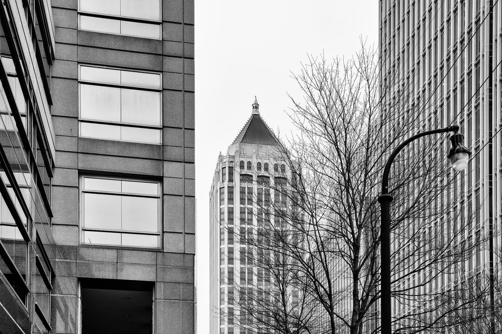 Black and white photograph of the high-rise modern architecture of Midtown Atlanta, focused on One Atlantic Center, once the tallest skyscraper in town.