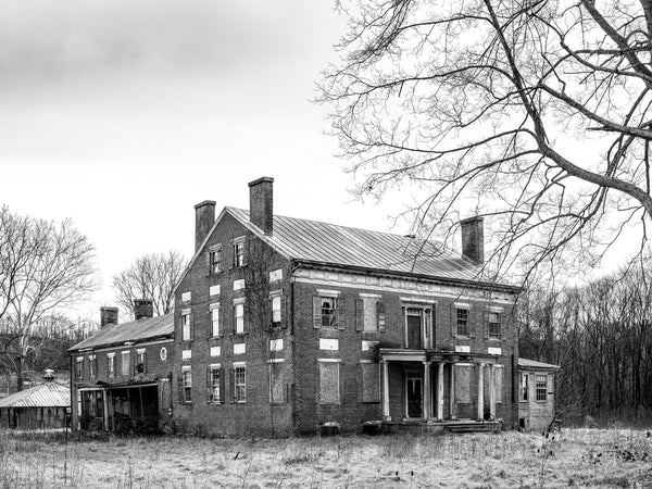 Black and white photograph of the historic John Preston House, also called the Preston-Crockett House or Herondon. Whichever name one chooses, the house represents fascinating and controversial history. The house was built in 1842, to serve as a tavern and inn on the old Wilderness Road, replacing an older and smaller log tavern that had developed a shady reputation. The former innkeeper was suspected of taking advantage of unwary travelers, even to the point of possibly robbing and murdering some of them. 